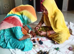 Making crochet covers for door knobs in an initiative started by Charu in Rajasthan.