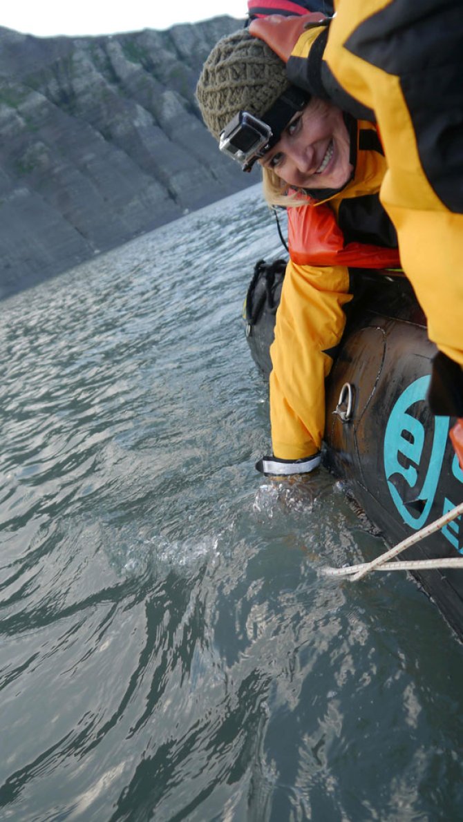 Andrea sampling zooplankton using a plankton net.